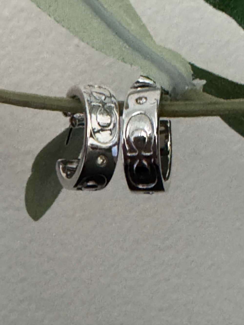 Coach C signature huggie hoop earrings.